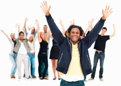 Group of happy friends standing against white background and raising hands